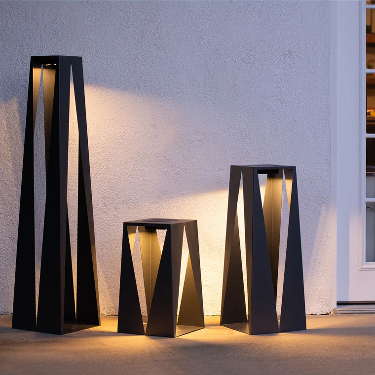 Set of modern indoor outdoor floor solar lanterns against a light wall  by Les Jardins from Spacio retail stores in India. 