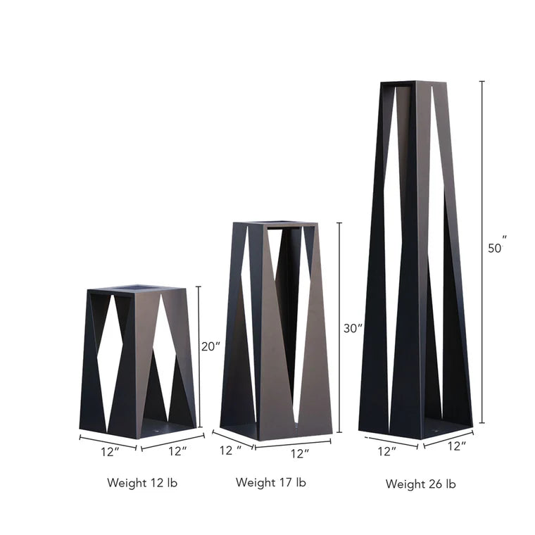 Three black geometric candle holders with measurements and weights on a white background  by Les Jardins from Spacio retail stores in India. 