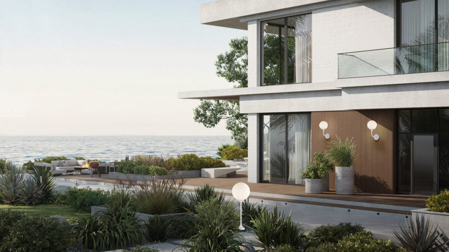 Modern house with ocean view and garden and wall / floor lamps from Masiero