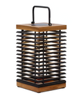 Decorative solar lantern with wooden top and black metal base on a white background