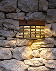 Solar wall light fixture embedded in a stone wall  by Les Jardins available at Spacio in India. 