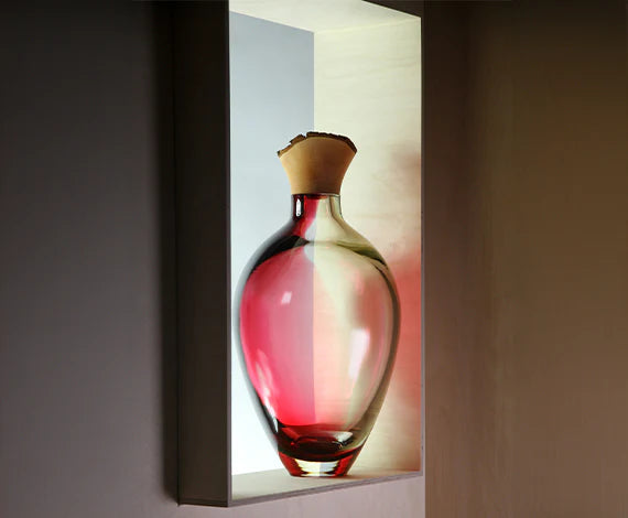 Sculptural Vase on a light shelf against a dark background