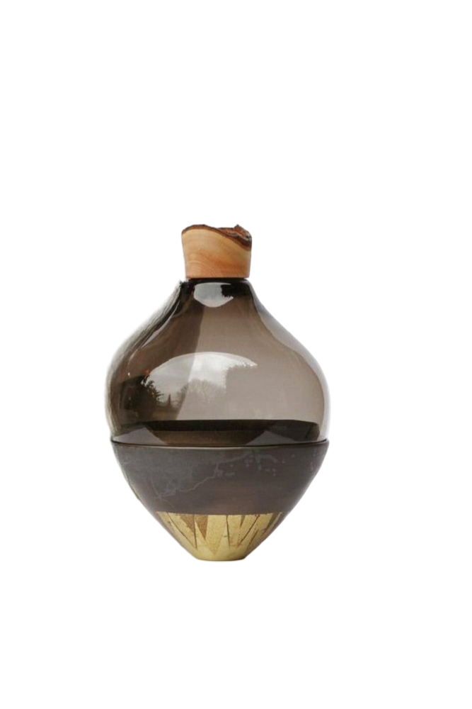 Decorative sculptural vase with a wooden top and base on a white background from Utopia & Utility, available at Spacio retail stores in Mumbai & Kolkata. 
