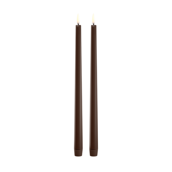 Two tall, dark brown led taper candles standing upright side by side on a plain white background.