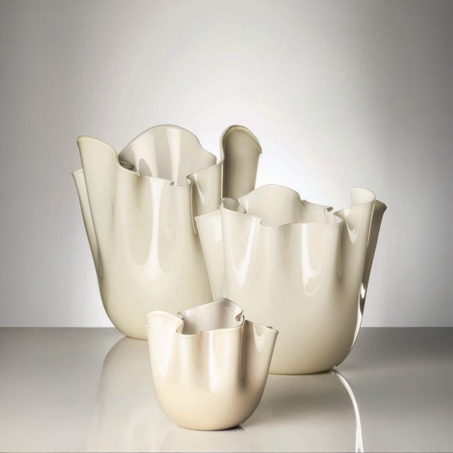 Set of three Cream-colored venini murano vase on a white background at Spacio retail store in Mumbai 