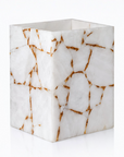 White quartz with gold foil dustbin on a white background