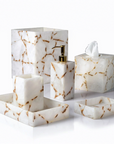 White quartz bathroom accessory set with gold foil on a white background
