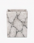 White quartz with silver foil dustbin on a white background
