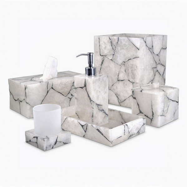 White quartz with silver foil bathroom accessory set including a tissue box, dispenser, and other items on a white background.
