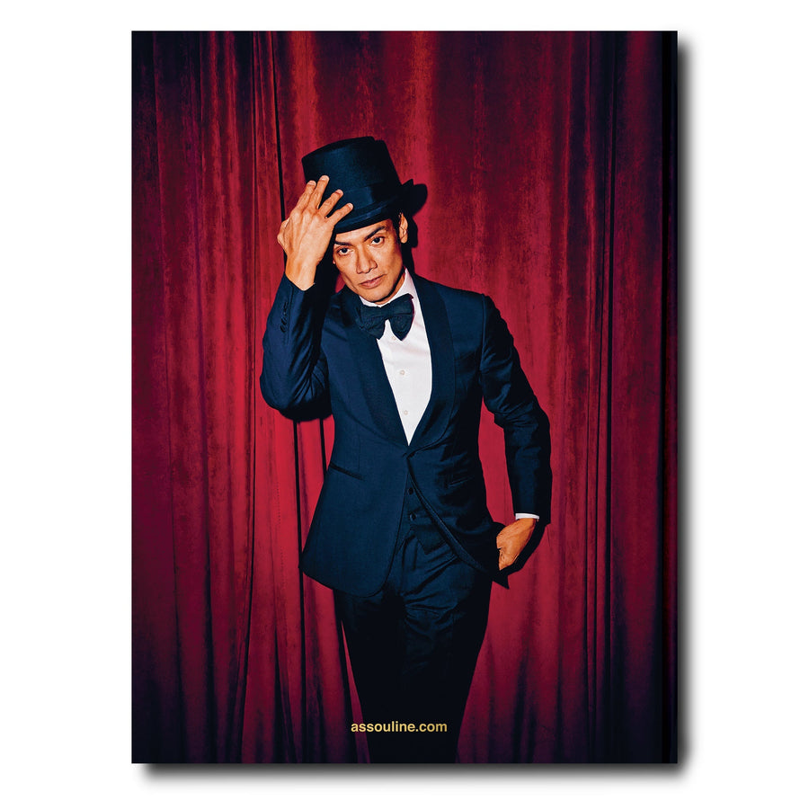 The back page of Assouline New York Chic coffee table book displaying photo of a Magician on white back ground available at Spacio India for luxury home decor accessories collection of Travel Coffee Table Books.