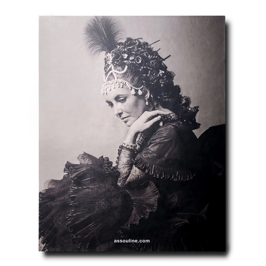 The back page of Assouline Bals: legendary costume balls of the twentieth century coffee table book on a white back ground available at Spacio India for luxury home decor accessories collection of Fashion Coffee Table Books.