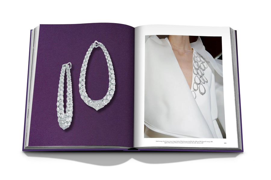 Assouline Boghossian: Expertise Craftsmanship Innovation coffee table book displaying photo of Boghossian Merveilles Halo 18k White Gold Diamond Extra Large Earrings & it wored on white dress as fashion on white background at Spacio India for luxury home decor collection of Jewellery Coffee Table Books.