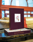 Assouline Boghossian: Expertise Craftsmanship Innovation coffee table book on a coffee table in a modern interior at Spacio India for luxury home decor collection of Jewellery Coffee Table Books.