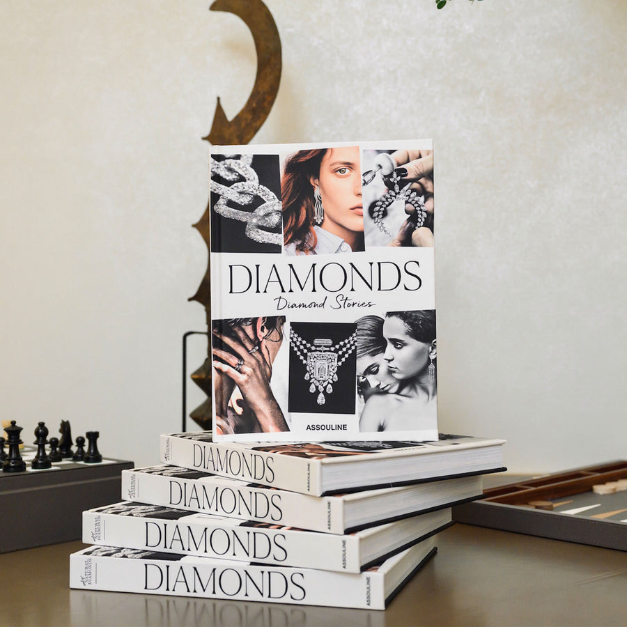 Assouline Diamonds: Diamonds Stories coffee table book on a surface in modern interior available at Spacio India for luxury home decor collection of Jewellery Coffee Table Books.