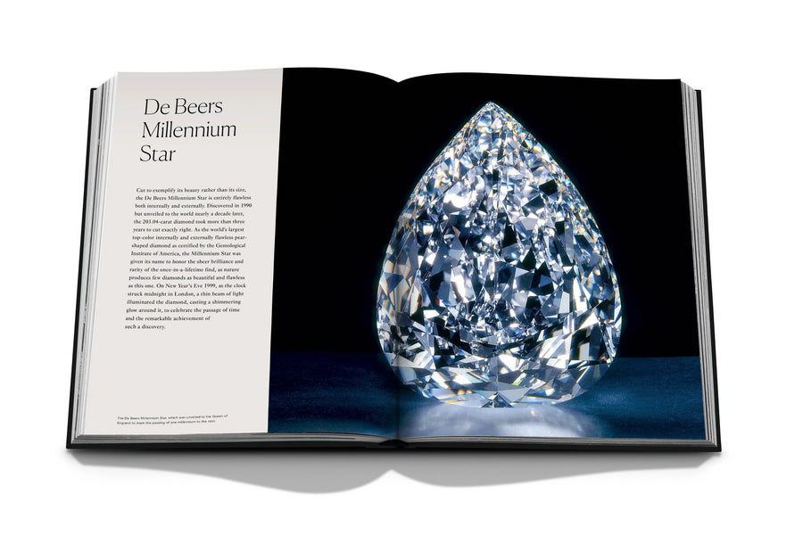 Assouline Diamonds: Diamonds Stories coffee table book displaying image of De Beers Millennium star diamond on a white back ground available at Spacio India for luxury home decor collection of Jewellery Coffee Table Books.