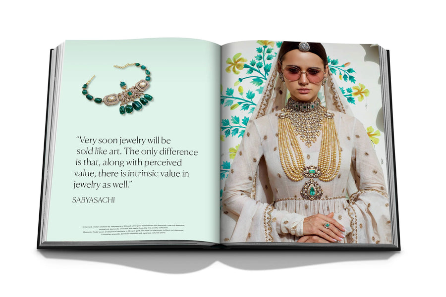 Assouline Diamonds: Diamonds Stories coffee table book displaying image of Model wearing Sabyasachi Gold-Green Jewellery in traditional outfit with his quote on a white back ground available at Spacio India for luxury home decor collection of Jewellery Coffee Table Books.