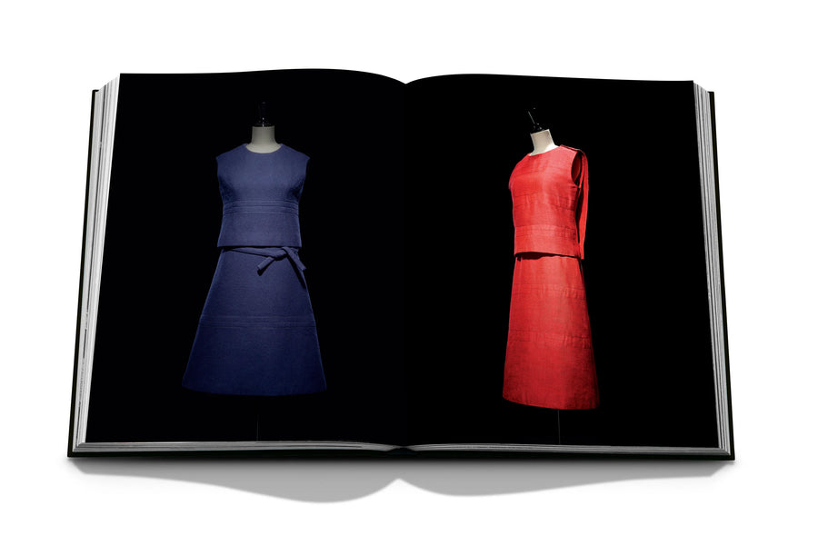 Assouline Dior by Marc Bohan coffee table book displaying photo of Blue & Red Dresses on a white back ground available at Spacio India for luxury home decor collection of Fashion Coffee Table Books.