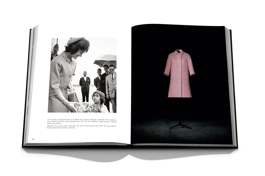 Assouline Dior by Marc Bohan coffee table book displaying photo of Jacqueline Kennedy Onassis - Former First Lady of the United States wearing Dior's Pink Dress in 1961 on a white back ground available at Spacio India for luxury home decor collection of Fashion Coffee Table Books.