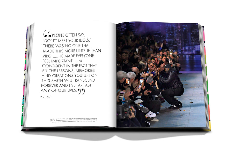 Assouline Louis Vuitton: Virgil Abloh Classic Cartoon Cover coffee table book displaying photo of Virgil Abloh at Fashion Week show with audience on a white back ground available at Spacio India for luxury home decor accessories collection of Fashion Coffee Table Books.