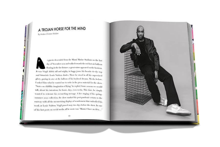 Assouline Louis Vuitton: Virgil Abloh Classic Cartoon Cover coffee table book displaying Image of Virgil Abloh & information on a white back ground available at Spacio India for luxury home decor accessories collection of Fashion Coffee Table Books.