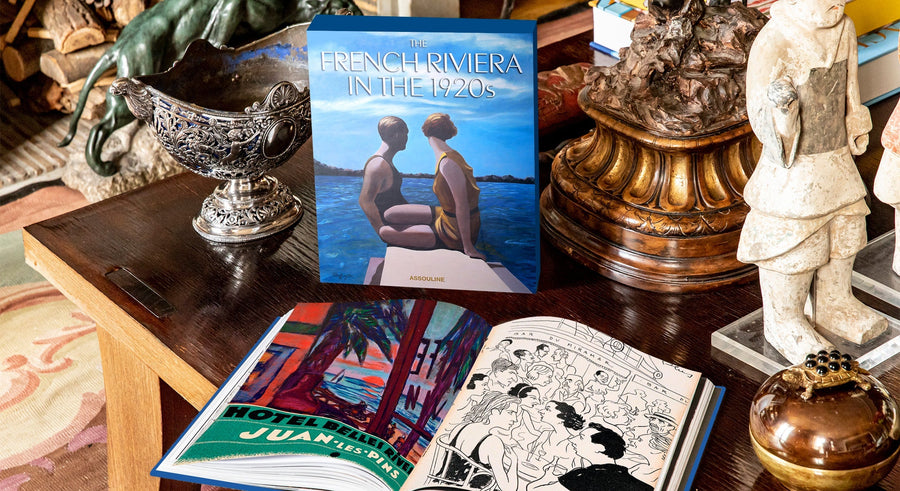 Assouline French Riviera In The 1920s coffee table book on a baroque styled coffee table with other accessories available at Spacio India for luxury home decor collection of Travel Coffee Table Books.