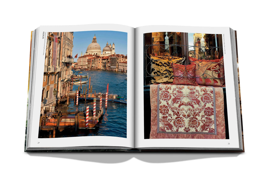 Assouline Italian Chic coffee table book displaying photo of Grand Canal & cushions from Italy restaurants spaces from Italy a white back ground available at Spacio India for luxury home decor collection of Travel Coffee Table Books.