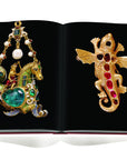 Assouline Jewels of the Renaissance coffee table book displaying Pendant jewel, gold, set with cabochon emeralds, form of hippocamp ridden & Salamander Pendant on a white background available at Spacio India for luxury home decor accessories collection of Jewellery Coffee Table Books.