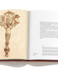 Assouline Jewels of the Renaissance coffee table book displaying print of 1520's fan handle design with information on a white background available at Spacio India for luxury home decor accessories collection of Jewellery Coffee Table Books.