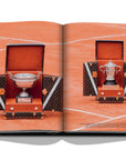 Assouline Louis Vuitton: Trophy Trunks coffee table book displaying photo of Louis Vuitton French Open Trophy Trunks 2017 on a white back ground available at Spacio India for luxury home decor accessories collection of Fashion Coffee Table Books.