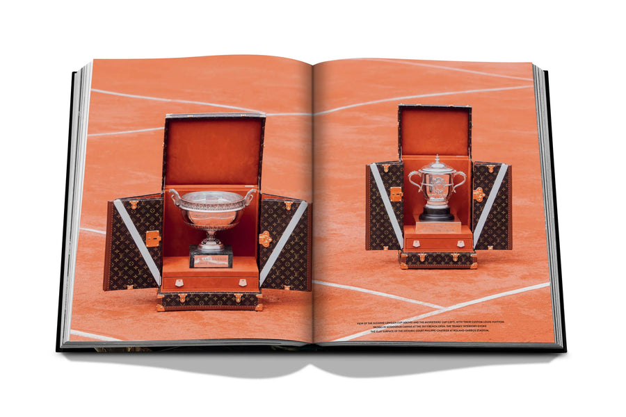 Assouline Louis Vuitton: Trophy Trunks coffee table book displaying photo of Louis Vuitton French Open Trophy Trunks 2017 on a white back ground available at Spacio India for luxury home decor accessories collection of Fashion Coffee Table Books.