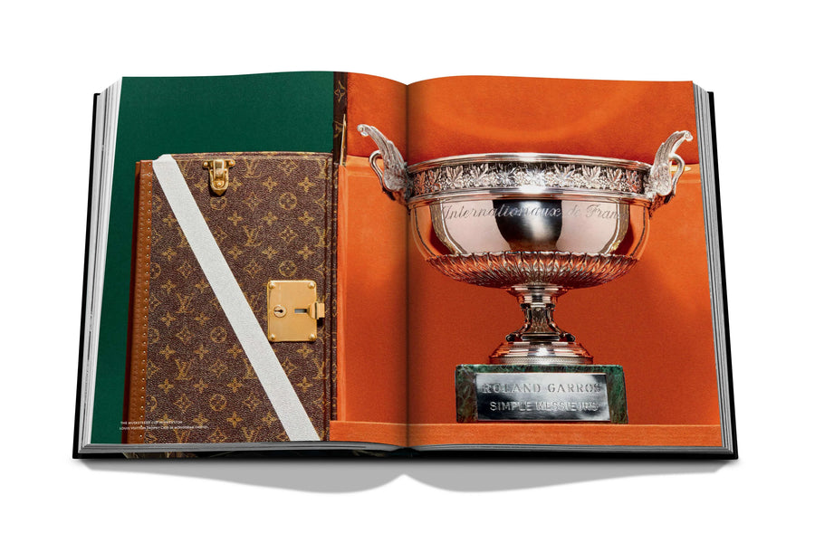 Assouline Louis Vuitton: Trophy Trunks coffee table book displaying image of picture shows the trophy of the tennis open of rome on may 17 on a white back ground available at Spacio India for luxury home decor accessories collection of Fashion Coffee Table Books.