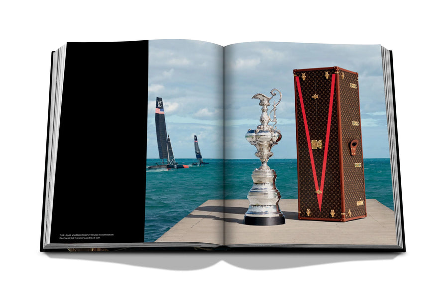 Assouline Louis Vuitton: Trophy Trunks coffee table book displaying image of The America's Cup case was handmade by the Maison's artisans on a white back ground available at Spacio India for luxury home decor accessories collection of Fashion Coffee Table Books.