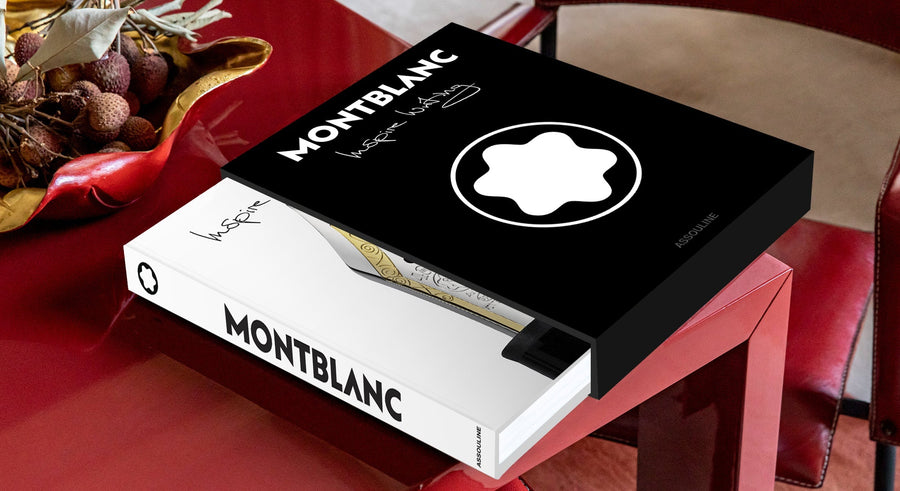 Assouline Montblanc coffee table book on a red center table with a bowl available at Spacio India for luxury home decor accessories collection of Fashion Coffee Table Books.