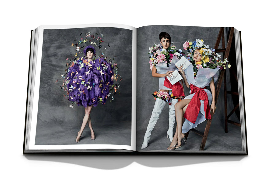 Assouline Moschino coffee table book displaying photos of fashion dresses by American fashion designer Jeremy Scott wore by Models on a white back ground available at Spacio India for luxury home decor accessories collection of Fashion Coffee Table Books.