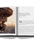 Assouline Paris Chic coffee table book displaying photo of distant view of Eiffel Tower with quote on white back ground available at Spacio India for luxury home decor accessories collection of Travel Coffee Table Books.