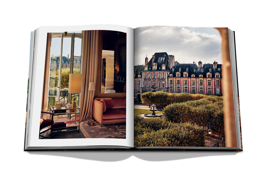 Assouline Paris Chic coffee table book displaying photos of Place des Vosges Museum & interior of apartment on white back ground available at Spacio India for luxury home decor accessories collection of Travel Coffee Table Books.