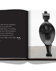 Assouline Paris in the 1920s with Kiki De Montparnasse Coffee Table Book displaying photo of Spoon Woman Sculpture with a quote on a white back ground available at Spacio India for luxury home decor accessories collection of Travel Coffee Table Books.