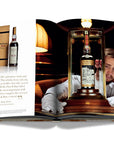 Assouline Coffee Table Book The Impossible Collection of Whiskey page displaying a photo of The Macallan 1926, a rare & old Whiskey bottle on a white back ground available at Spacio India for luxury home decor accessories collection of Ultimate Coffee Table Books.