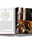 Assouline Coffee Table Book The Impossible Collection of Wine Limited Edition page displaying photo of close view of wine glass on a white back ground available at Spacio India for luxury home decor accessories collection of Ultimate Coffee Table Books.