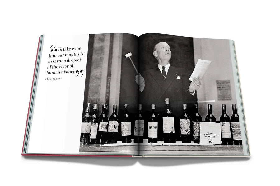 Assouline Coffee Table Book The Impossible Collection of Wine Limited Edition page of Wine Auction on a white back ground available at Spacio India for luxury home decor accessories collection of Ultimate Coffee Table Books.