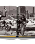 Assouline The Race of Gentlemen coffee table book displaying a man in a motorcycle race on a white back ground available at Spacio India for luxury home decor accessories collection of Sports Coffee Table Books.