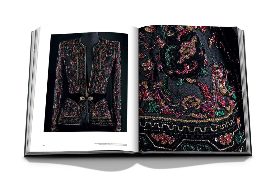 Assouline Zuhair Murad coffee table book cover with page of fashionable suit on white back ground available at Spacio India for luxury home decor accessories collection of Fashion Coffee Table Books.