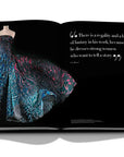 Assouline Zuhair Murad coffee table book cover with page of Blue desinger gown with quote on white back ground available at Spacio India for luxury home decor accessories collection of Fashion Coffee Table Books.