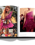 Assouline Zuhair Murad coffee table book cover with page of fashion model photoshoot wearing pink dress on white back ground available at Spacio India for luxury home decor accessories collection of Fashion Coffee Table Books.