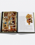 Open book with decorative illustrations on a white background