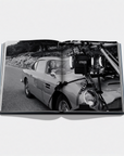 Open book showing a black and white photograph of a car on a road with filming equipment.