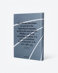 A hardcover book titled 'The Book About Cars' by Chris Gardner, featuring a slate blue-gray cover with white graphic lines and a black quote about James Bond and vehicles. The book is shown standing upright at a slight angle on a clean white background.