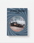 A hardcover book titled 'JAMES BOND CARS' by Assouline, featuring a blue cover with a circular car photo in the center resembling the James Bond gun barrel motif, shown on a light gray background.