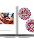 Assouline G Glenn: Spiro the art of a jewel coffee table book displaying photo of Glenn Spiro Mosaic Earrings in Titanium with Rubies, Yellow and White Diamonds on a white back ground available at Spacio India for luxury home decor collection of Jewellery Coffee Table Books.