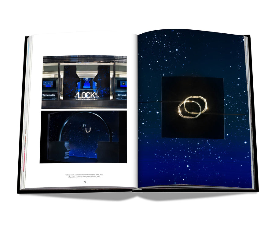 Assouline Windows at Tiffany & Co Icon Edition coffee table book page with two rings & blue showroom on white back ground available at Spacio India for luxury home decor accessories collection of Jewellery Coffee Table Books.